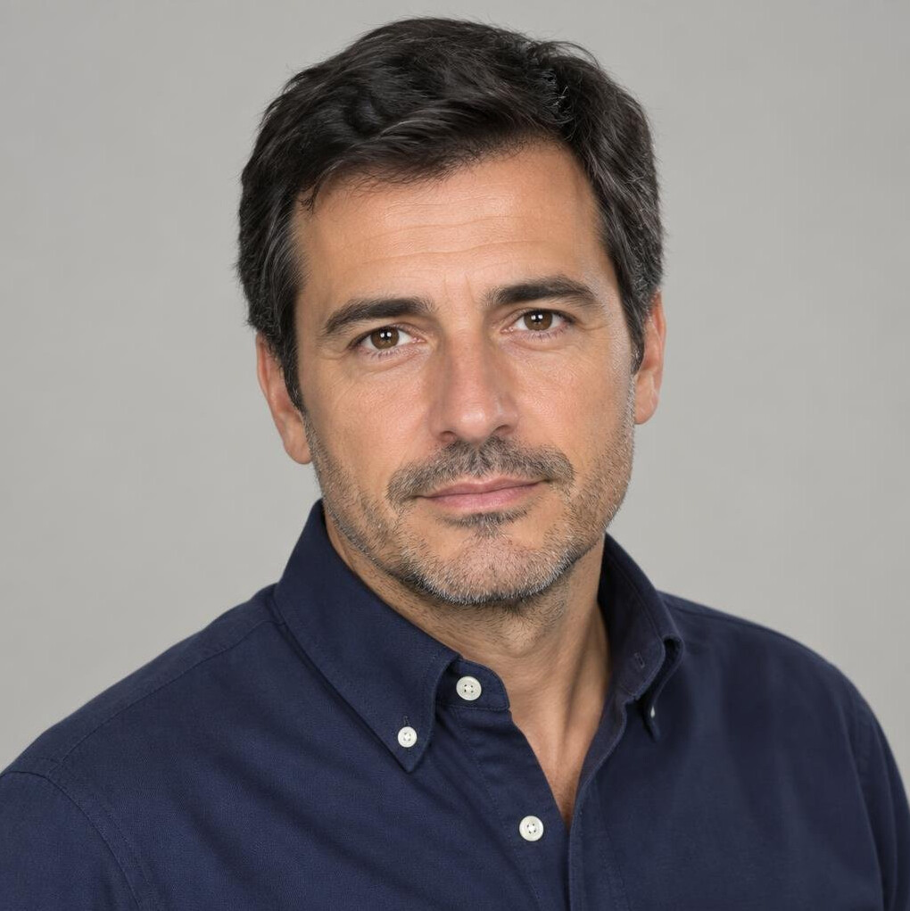 Studio portrait of a Portuguese man journalist in his forties